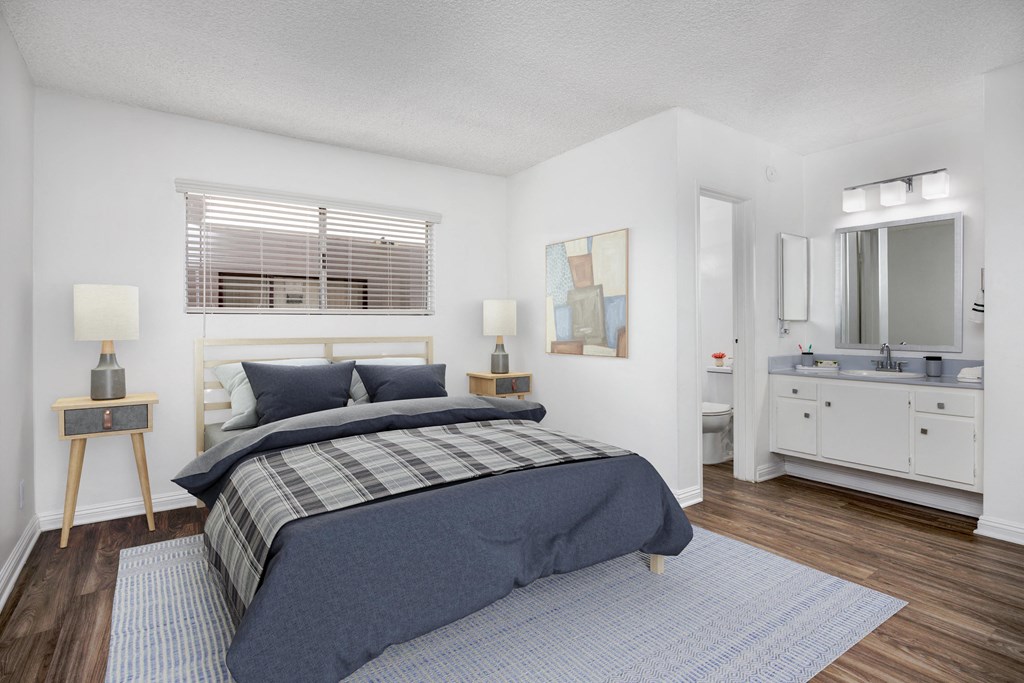 a bedroom with a bed and a bathroom