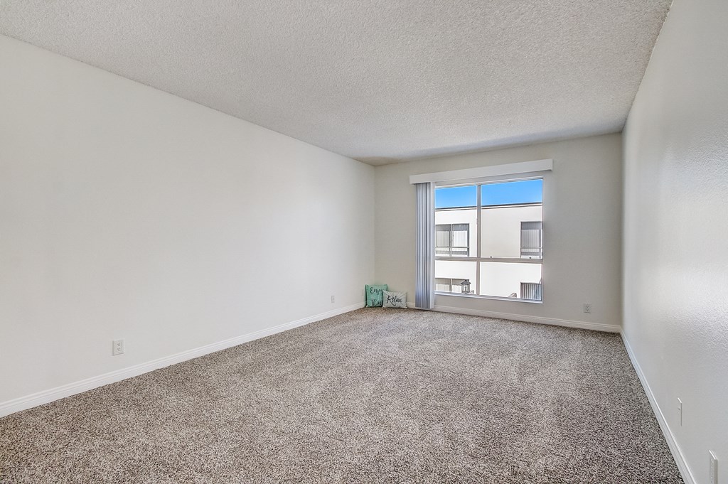 a bedroom with a large window