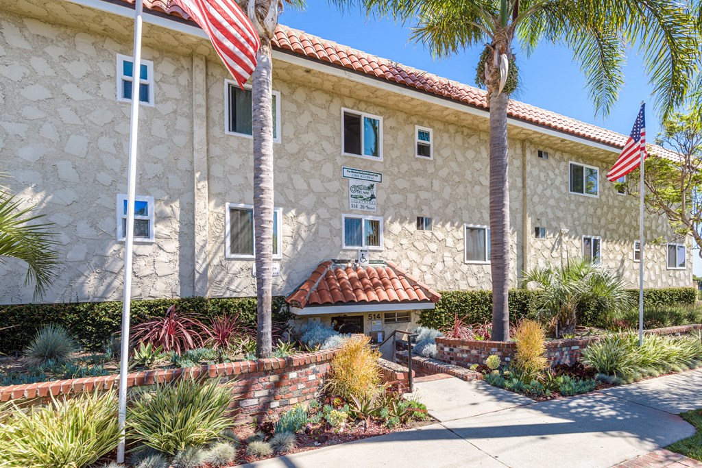 a building with two flags in front of it