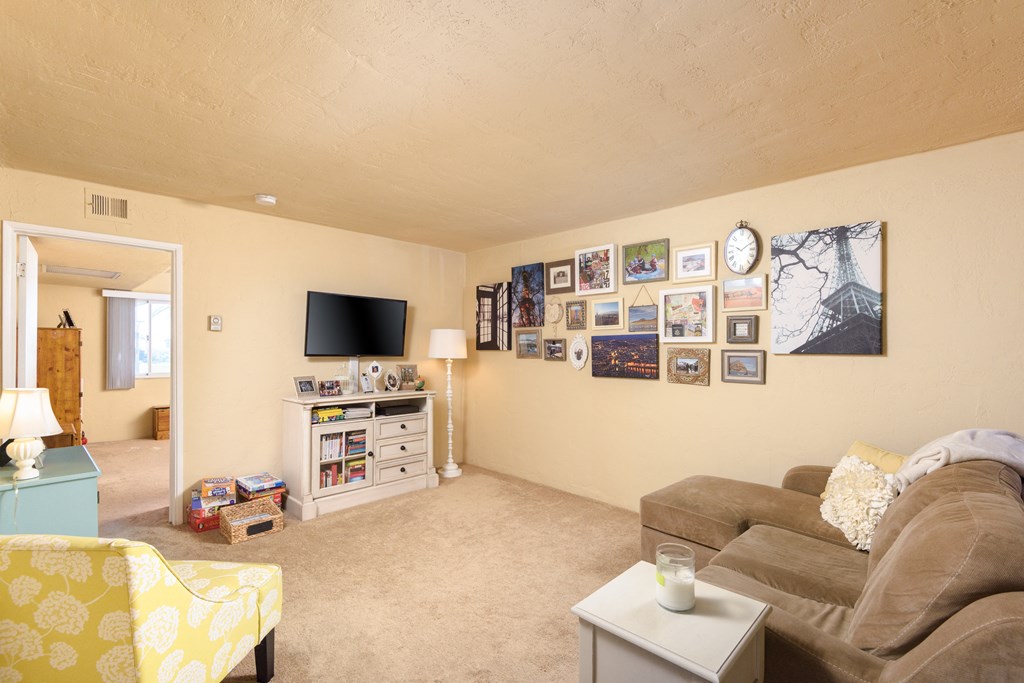 a living room with a couch and a tv