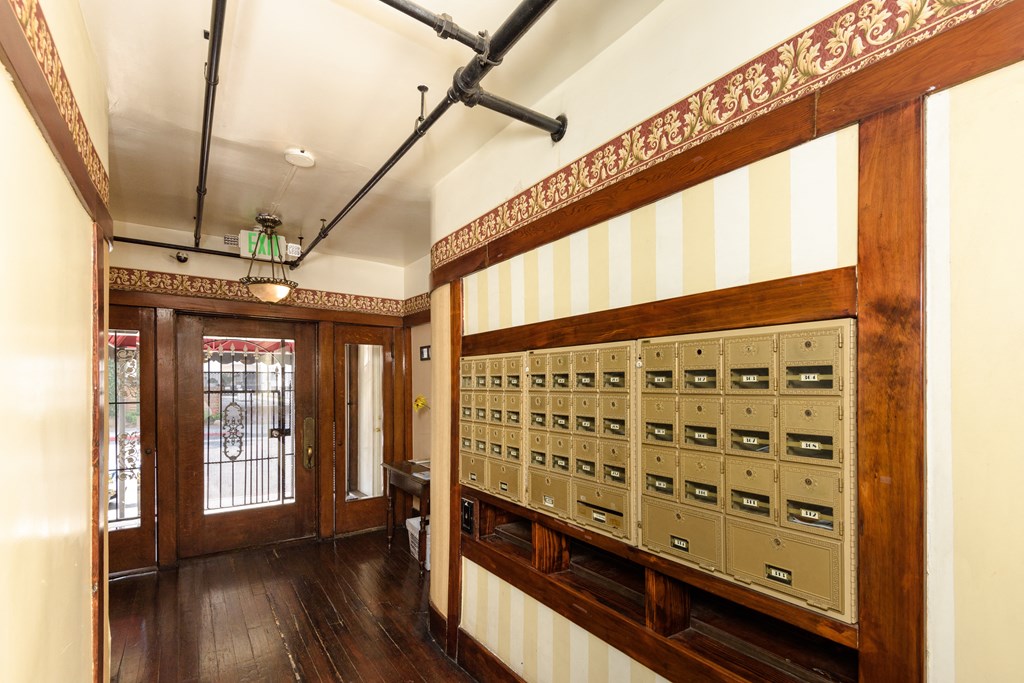 the entrance to a room with a filing cabinet and a door