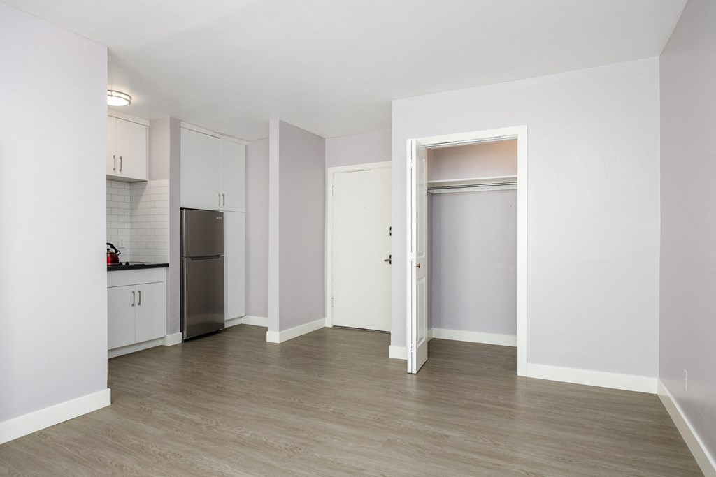 a kitchen and living room in a 555 waverly unit