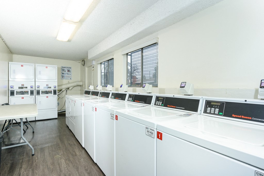 the laundry room is equipped with washers and dryers