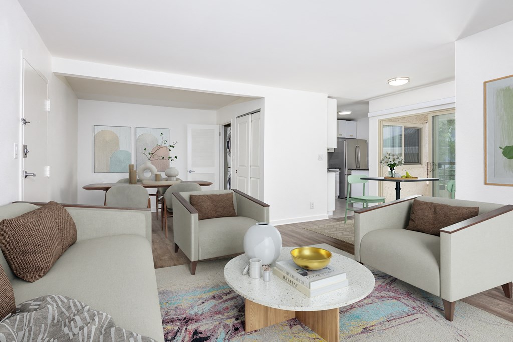 a living room with couches and chairs and a table