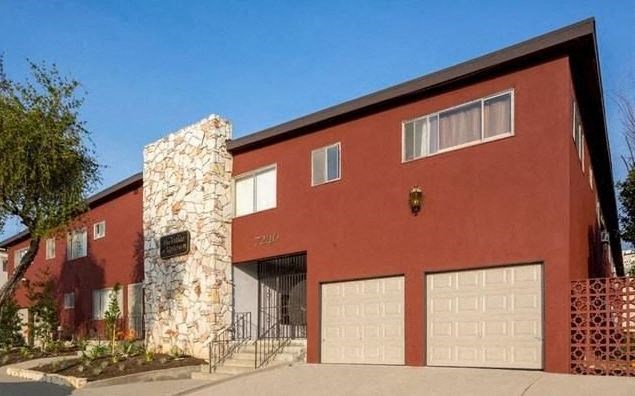 a red building with two garage doors