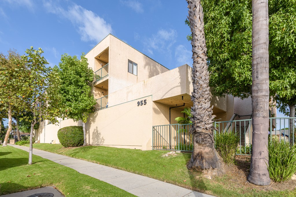 an apartment building with the address 385 on the side of the building