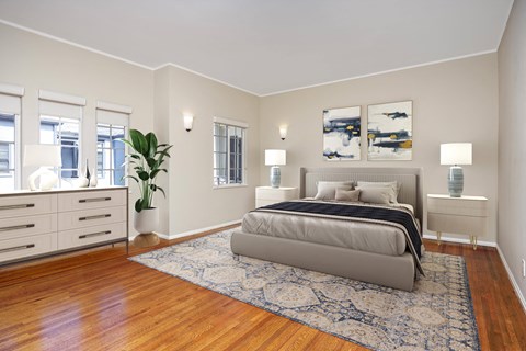 a bedroom with a bed and a rug