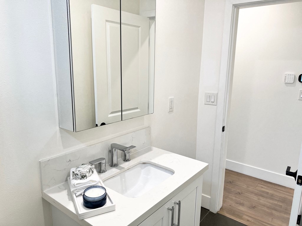 a bathroom with a sink and a mirror