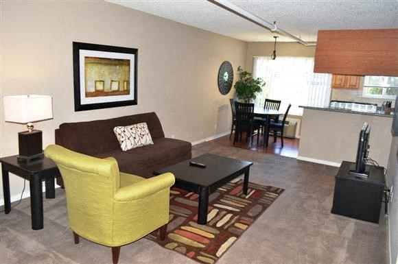 a living room with a couch and a table