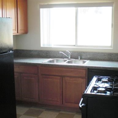 a kitchen with a stove and a sink