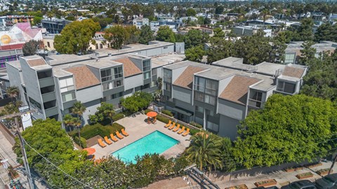 An aerial view of a residential complex with a swimming pool.