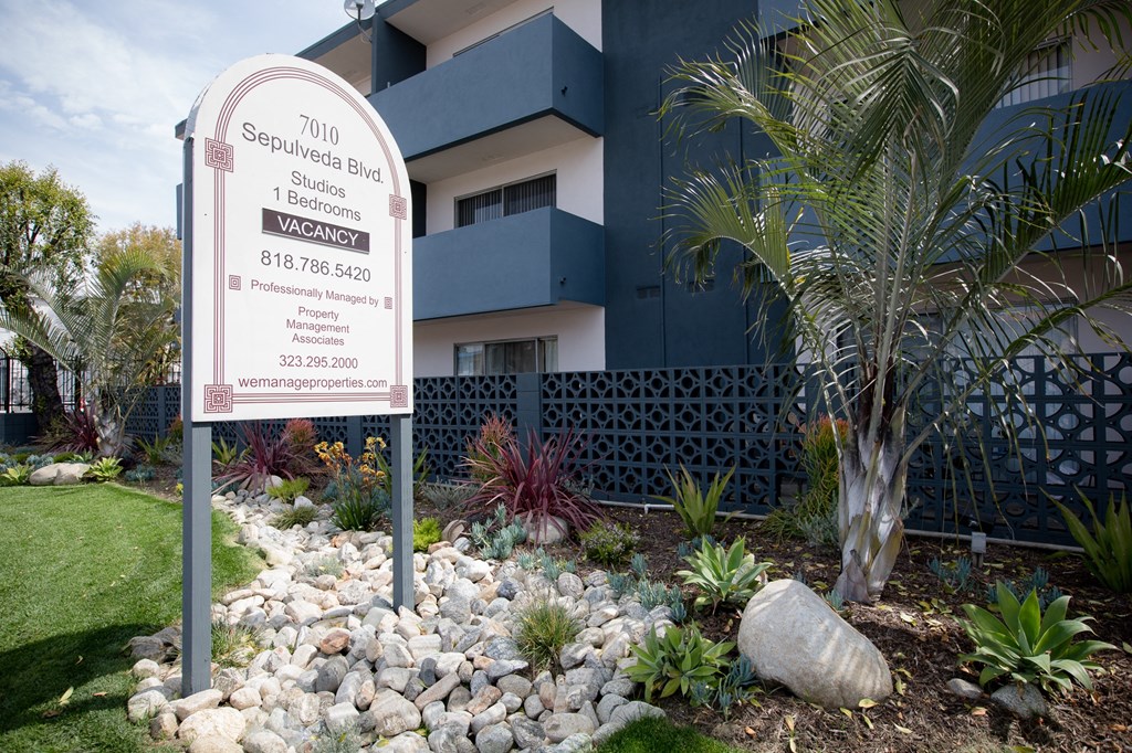 an image of a building with a sign in front of it