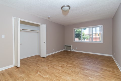 A room with a window and a door.