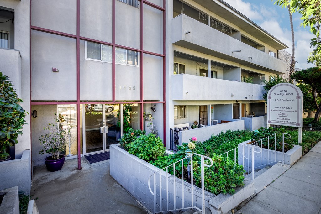the facade of a building with a staircase in front of it