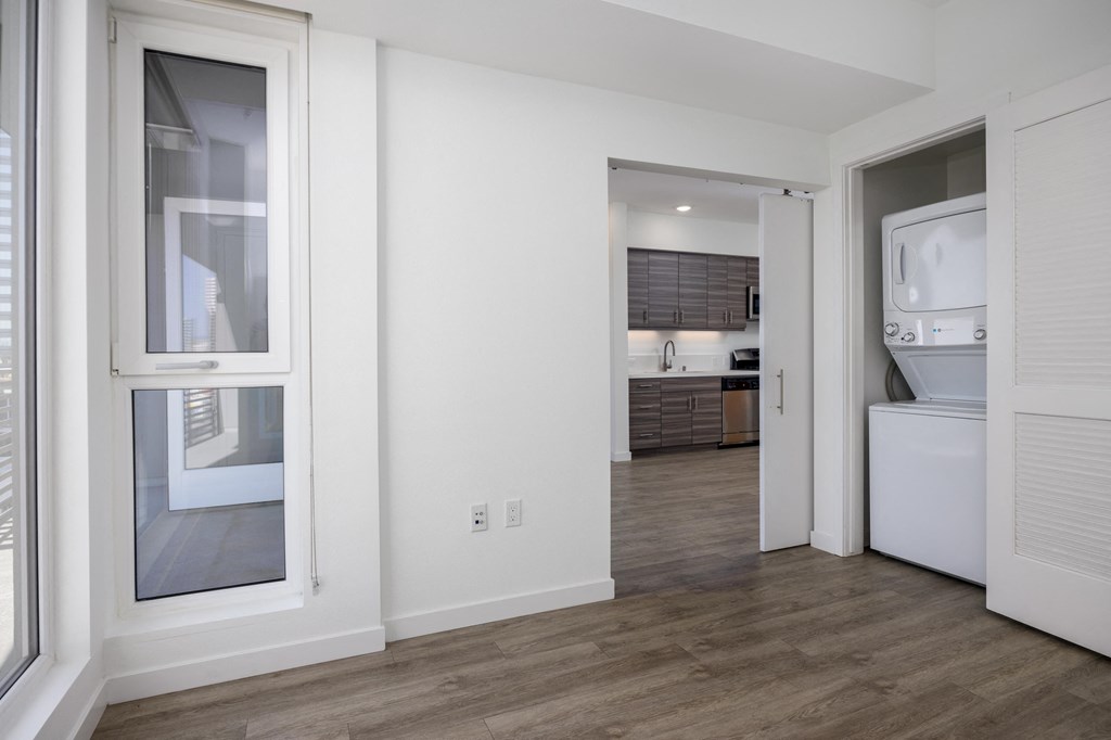 a view of a kitchen and a living room from a window