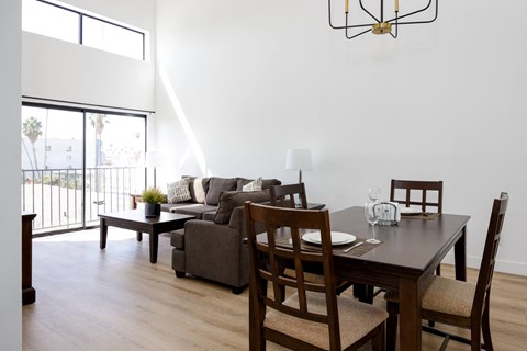 a living room and dining room with a couch and a table