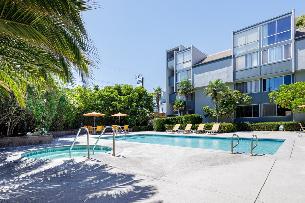 a swimming pool with a building in the background