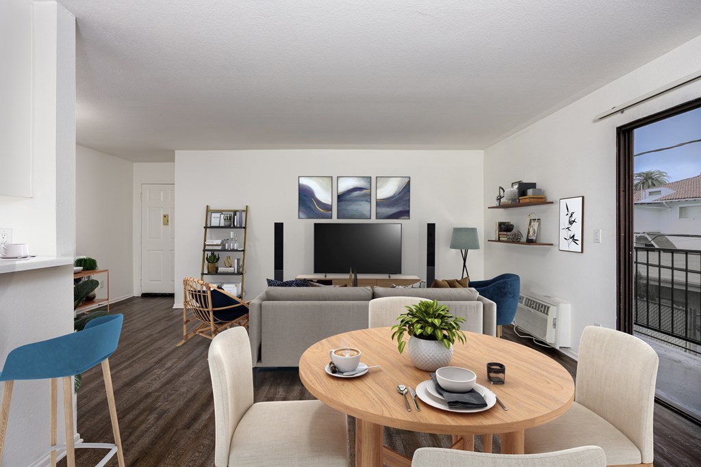 A modern dining room with a wooden table and chairs.