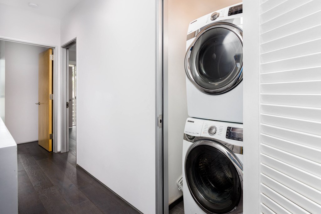 a front loading washer and dryer in a laundry room