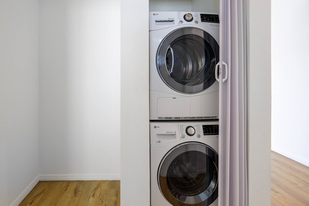 a front loading washer and dryer in a laundry room