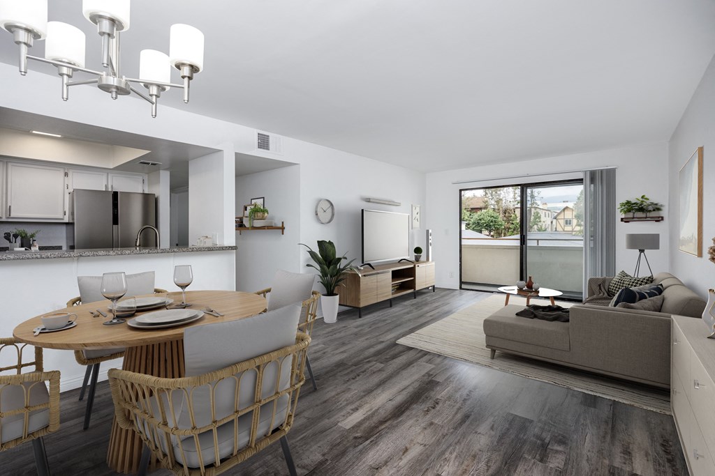 A modern dining room with a wooden table and chairs.