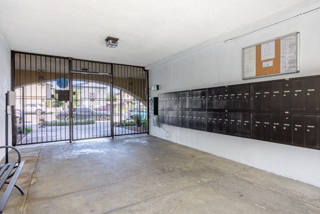 the entrance to a building with a gate and lockers