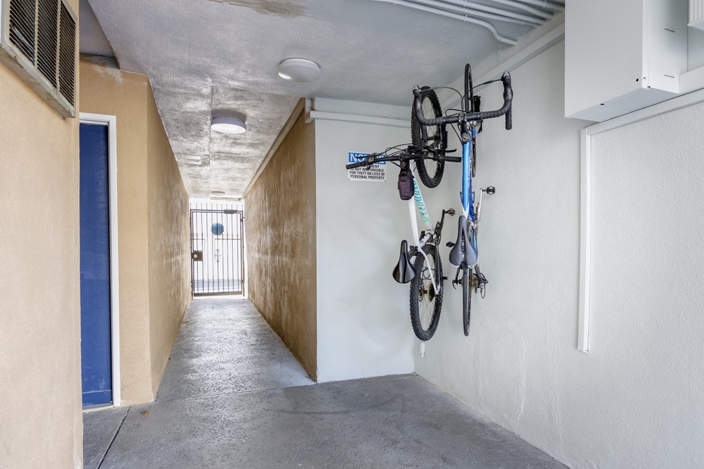a hallway with bikes hanging on the wall