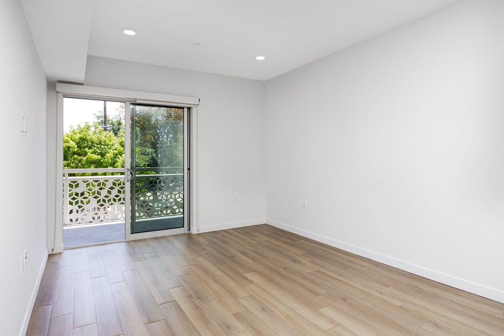 living room with a sliding glass door to a balcony