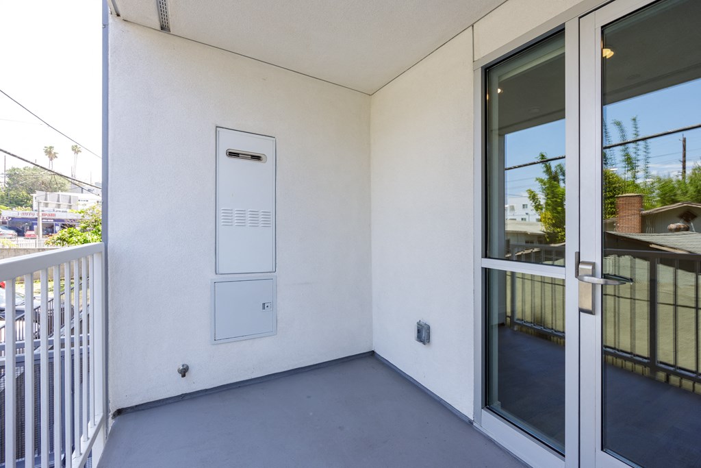 the entrance to a balcony with a sliding glass door