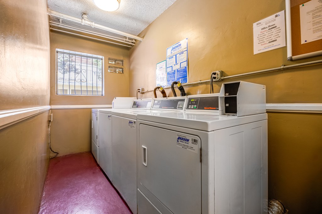 A laundry room with a washer and dryer.