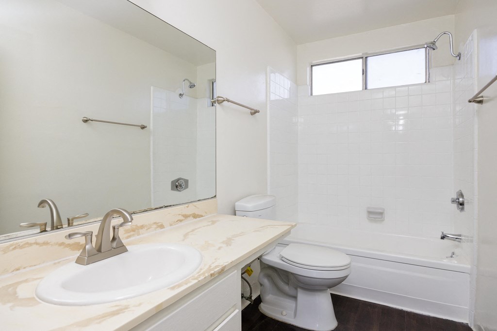 a bathroom with a sink toilet and a shower