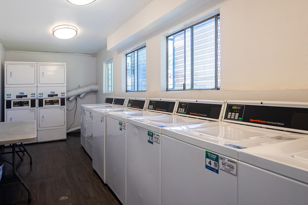 the laundry room is equipped with washers and dryers