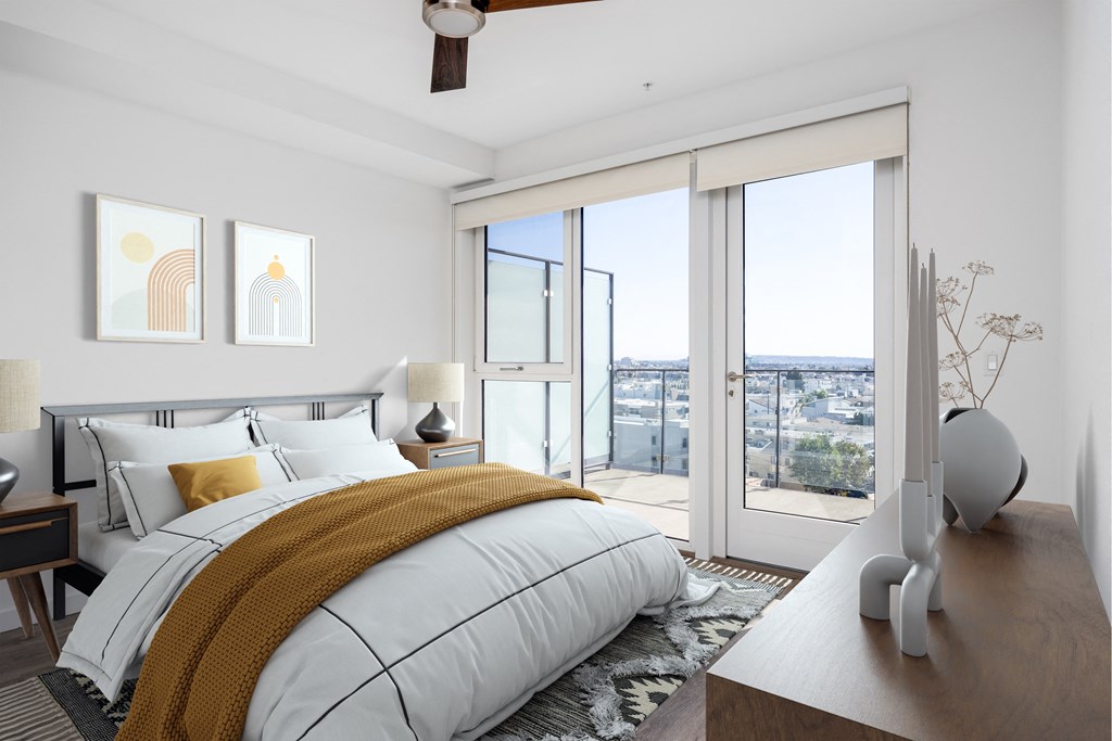 a bedroom with a bed and sliding glass doors