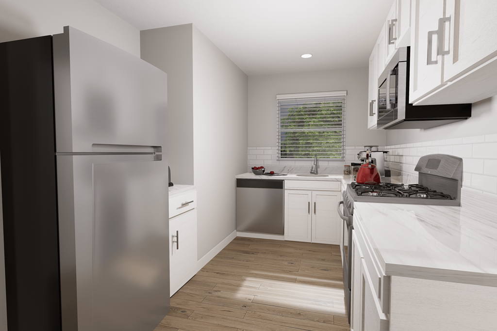 a kitchen with white cabinets and stainless steel appliances