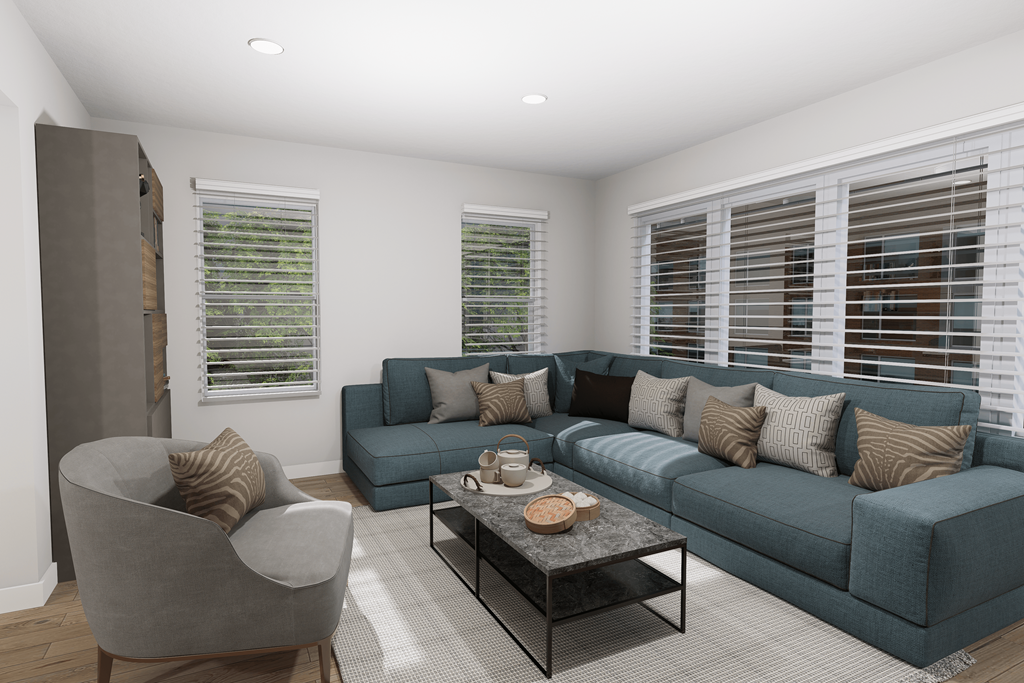 a living room with a blue couch and a coffee table