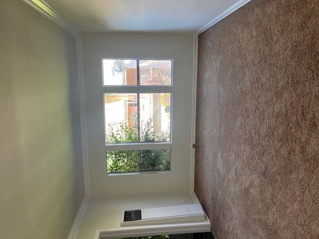 a view of a window from the top of a staircase