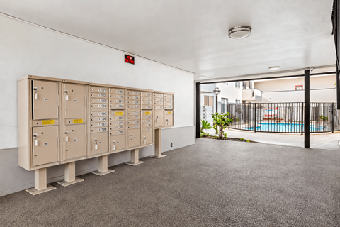 A room with a pool and a row of electrical boxes.