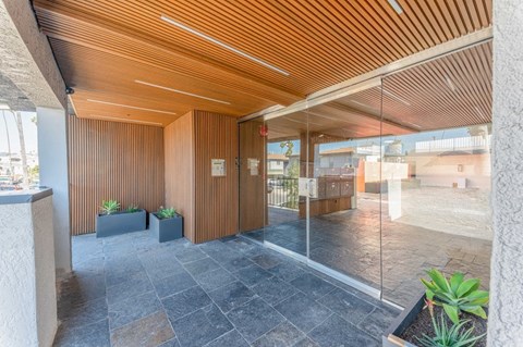 the lobby or reception area of a building with glass doors