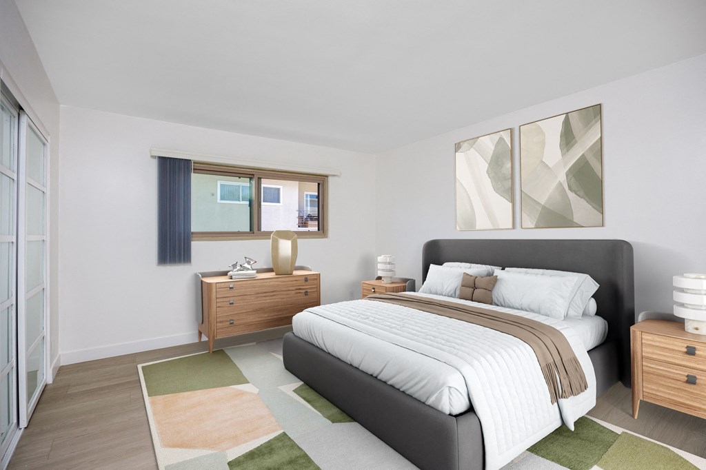 a bedroom with a bed and a dresser and a window