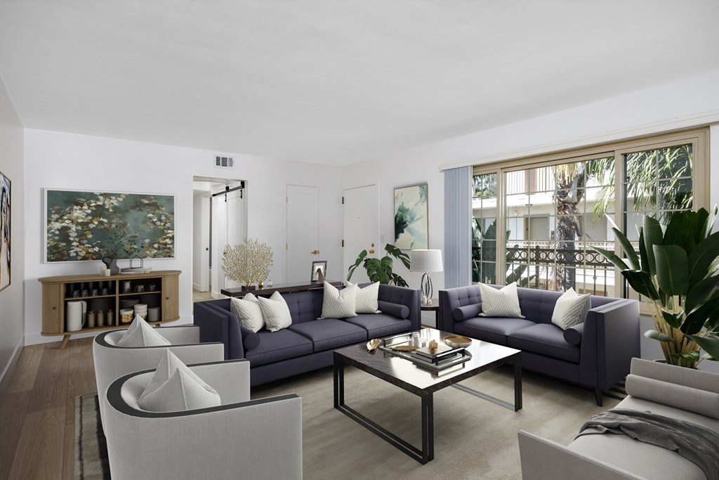 a living room with couches and chairs and a coffee table