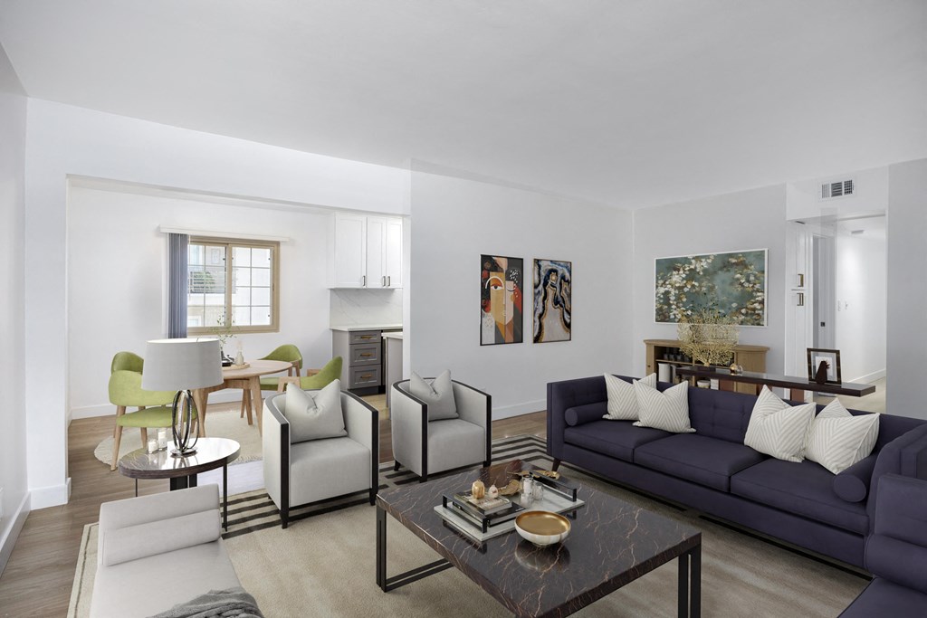 a living room with couches and chairs and a table