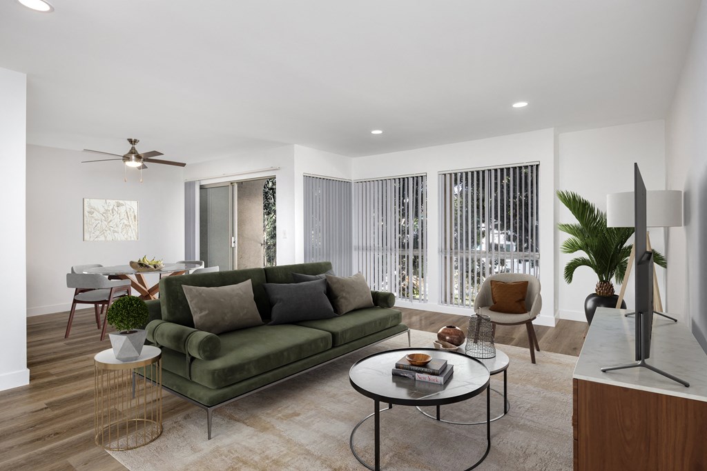 a living room with a green couch and a table