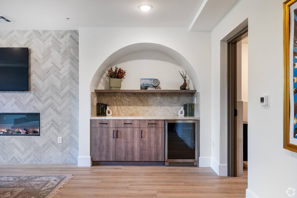 A modern living room with a fireplace and a tv.