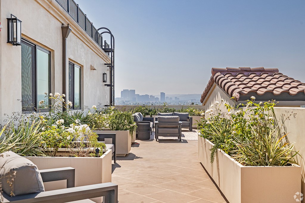A patio with a view of the city skyline.