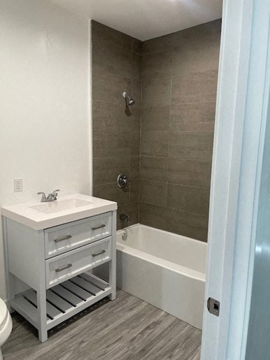 a bathroom with a sink and a bath tub