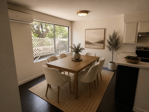 A dining room with a table and chairs.
