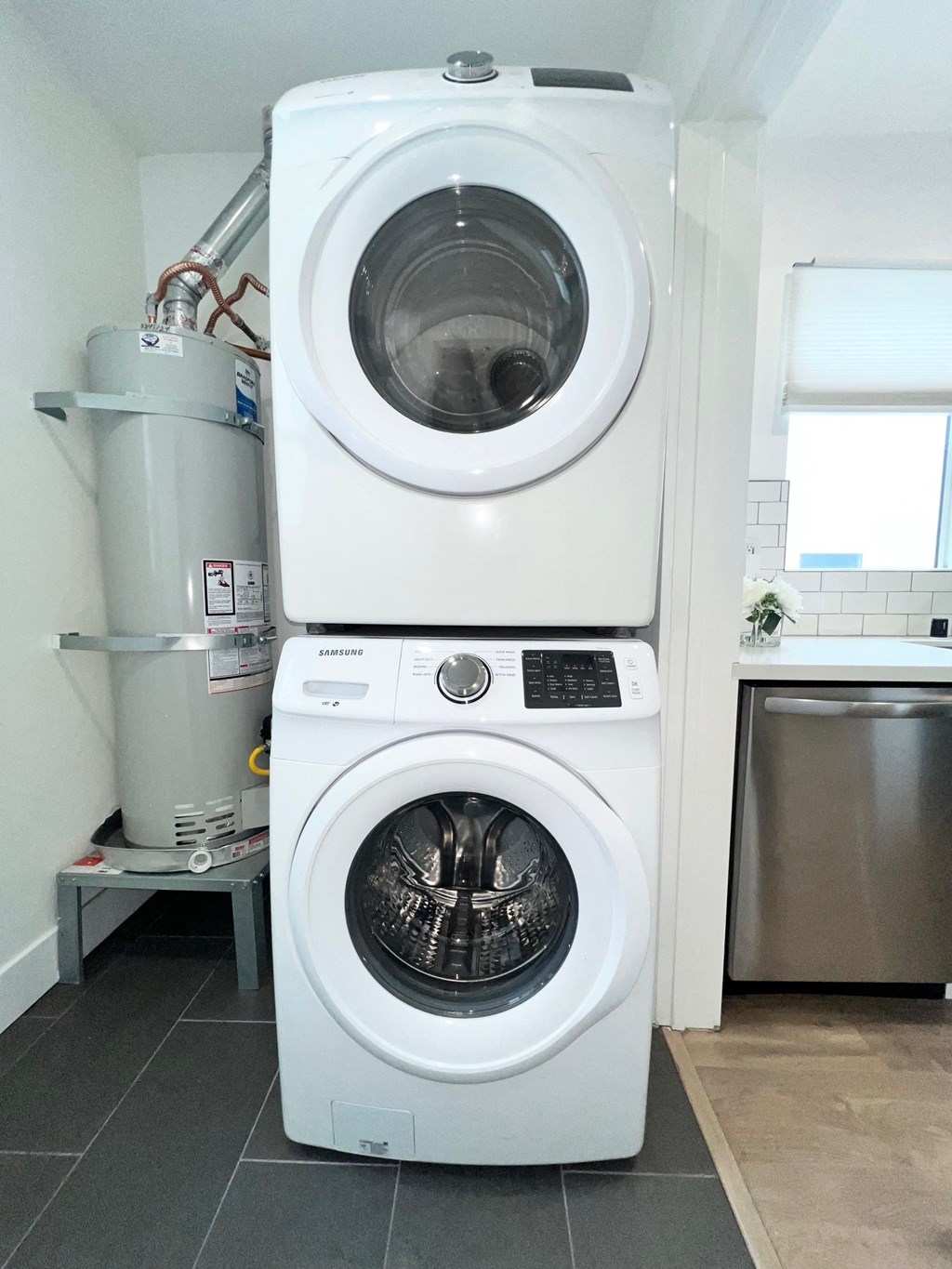 a washing machine and a dryer in a laundry room