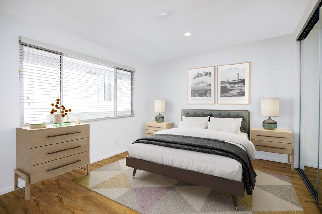 a bedroom with a bed and two windows