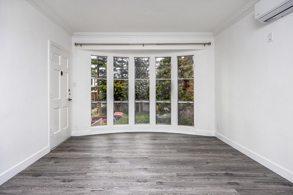 an empty room with a bay window