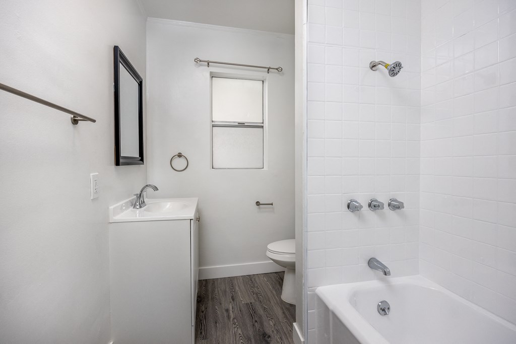 a bathroom with a toilet sink and bathtub